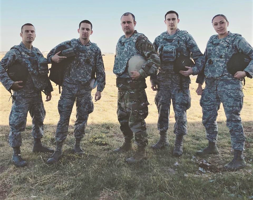 Defense Health Agency’s 2022 Senior Noncommissioned Officer of the Year U.S. Air Force Master Sgt. Douglas Rozelle (center) stands with his team from Wright Patterson Air Force Base in Ohio following their completion of the Medic Rodeo, a grueling four-day event challenging Air Force Medical Services personnel’s physical stamina and combat medical knowledge in 2019 at Cannon Air Force Base in New Mexico. Rozelle was a technical sergeant during the competition. (Courtesy Photo) 