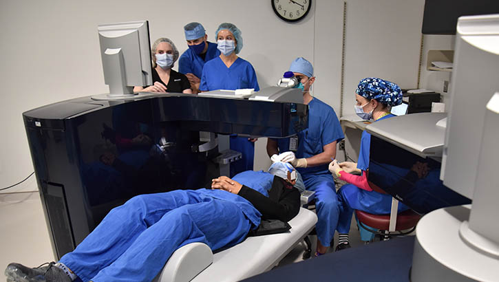 A surgical team with the Warfighter Refractive Eye Surgery Program at Womack Army Medical Center at Fort Bragg monitors the progress of a patient's surgery inside the Ophthalmology Clinic's Refractive Surgery suite.