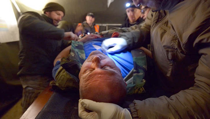 Image of a service member being treated.