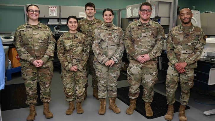 Senior Airman Kaylin Rice, from left, Staff Sgt. Anallely, Mendoza-Cuevas, Tech. Sgt. Clayton Proffer, Maj. Jenifer Mouser, Eduardo Rosado Garcia, and Bro'Derrick Baker, all members of the 66th Medical Squadron Laboratory & Radiology Flight, stand for a photo at Hanscom Air Force Base, Mass., April 20. The 66th Medical Squadron here is recognizing Medical Laboratory Professionals Week April 23 to 29. (U.S. Air Force photo by Jerry Saslav)