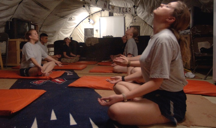 Airmen and Soldiers practice breathing and relaxation during their off duty time in a deployed location. Stress can take its toll on your mental and physical health, including your heart health, but there are breathing techniques to buffer yourself from it. (U.S. Air Force photo by Master Sgt. Lance Cheung)