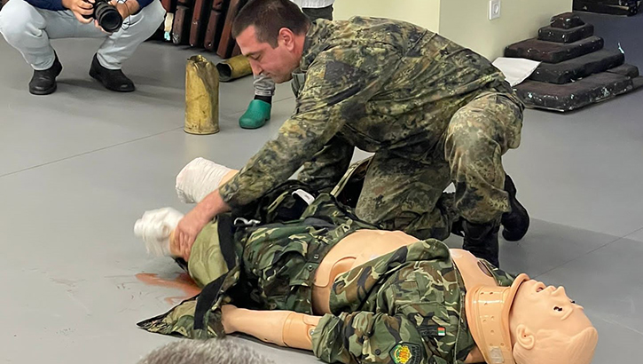 Medical professionals look on as a soldier assesses for combat paramedic certification on June 13 in Sofia, Bulgaria. (Courtesy Photo)