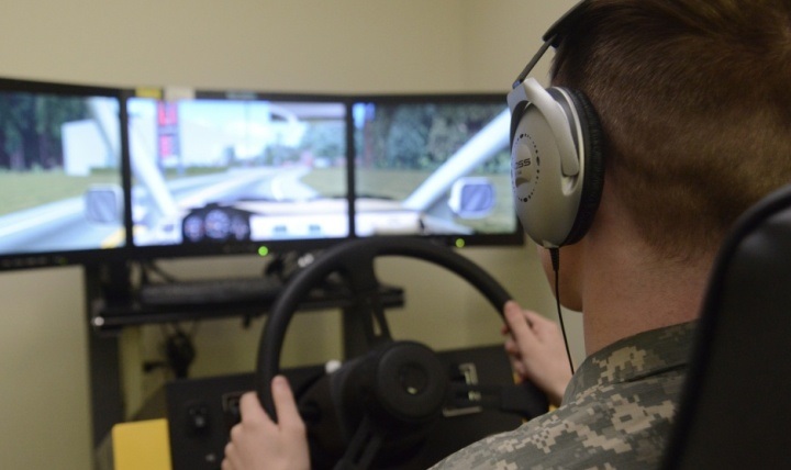 Link to Photo: A soldier at Joint Base Elmendorf-Richardson’s traumatic brain injury clinic in Alaska takes a cognitive hand-eye coordination test on a driving stimulator. 
