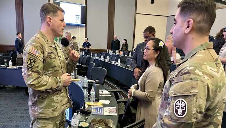 Munson Army Health Center Command Team, Col. Michael Mendenhall and Sgt. Maj. Jason Trevino, talk with an Army spouse following a brief during an Army Quality of Life Focus Panel on Fort Leavenworth, Kansas, Feb. 2.  (Photo: Maria Christina Yager)
