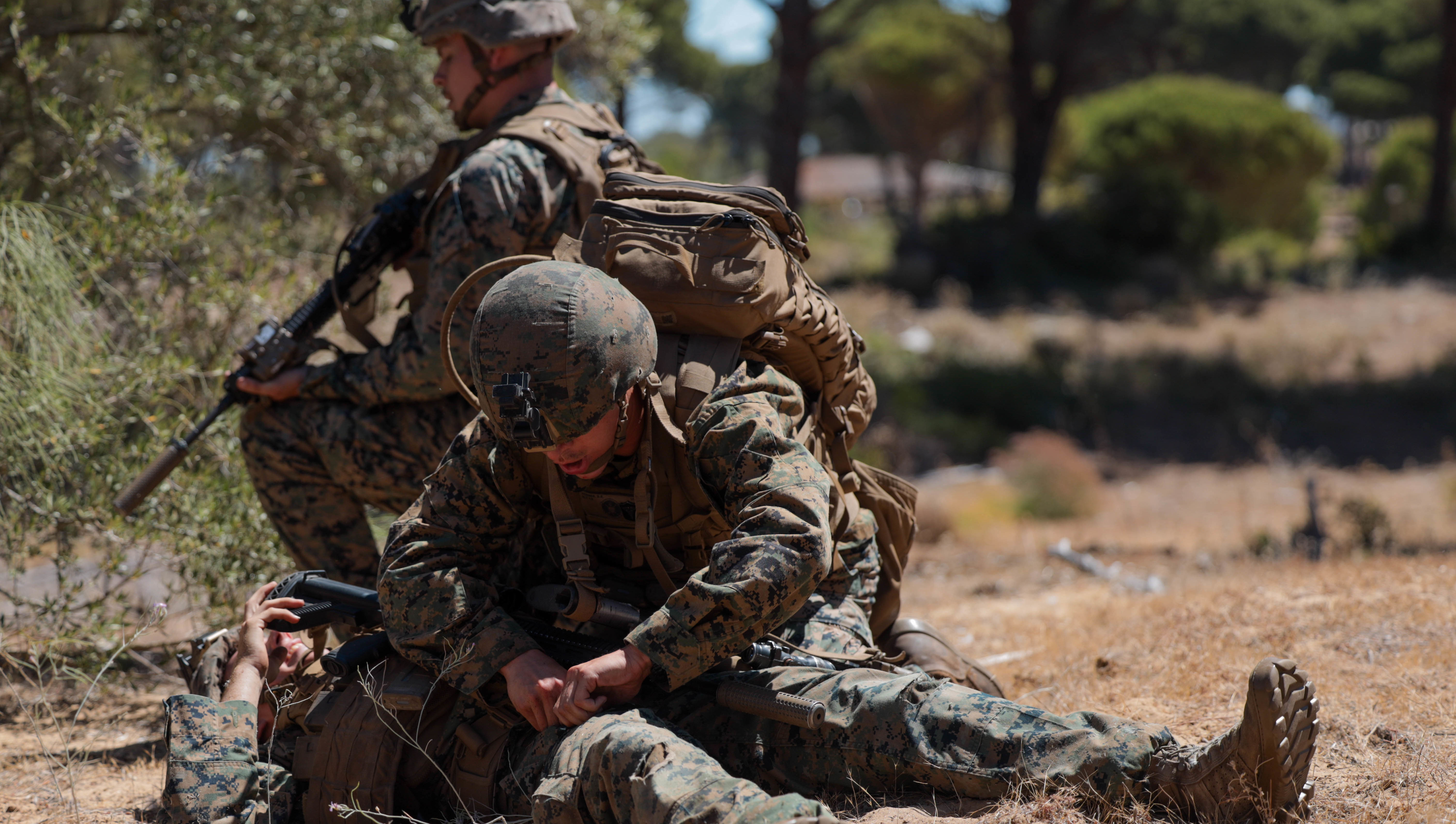 U.S. Navy Hospital Corpsman Dante Horner, a corpsman with 1st Battalion, 8th Marine Regiment, 2d Marine Division, performs tactical combat casualty care during Spanish FLOTEX-22 near Rota, Spain, June 9, 2022. This exercise features tactical level actions ashore, combined with joint training and planning, aimed at increasing overall bilateral interoperability between nations. (U.S. Marine Corps photo by Lance Cpl. Megan Ozaki)