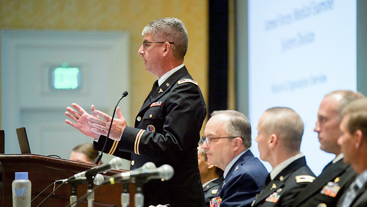 Image of Army Col. Louis Finelli of the Armed Forces Medical Examiners System speaks at a panel discussion during the 2019 Military Health System Research Symposium. .