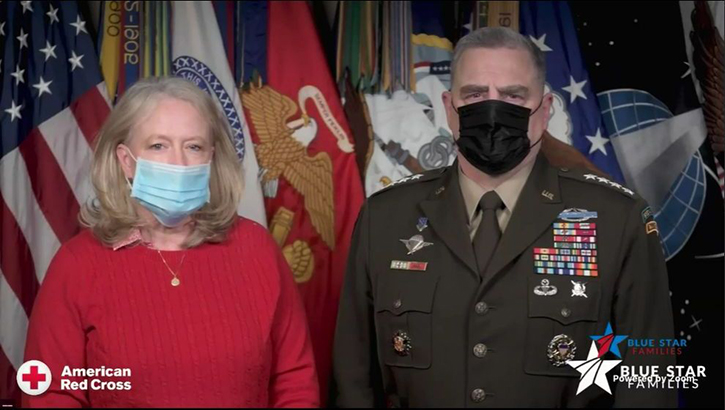 Image of Mr. and Mrs. Milley, wearing masks, standing in front of various flags.