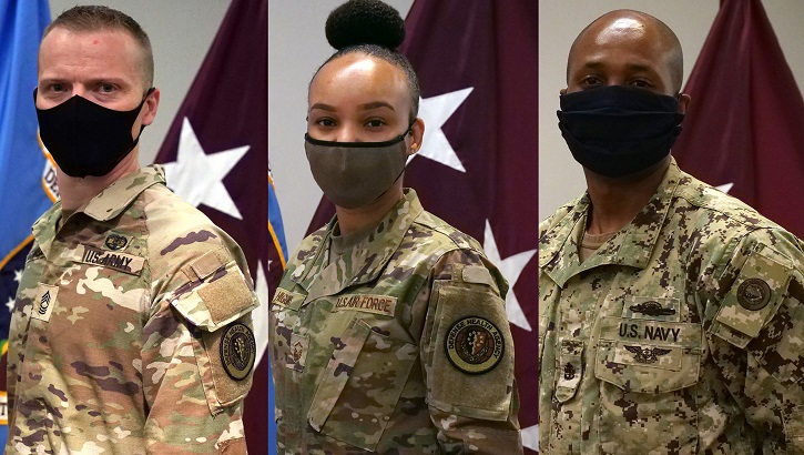 Service members from the Army, Air Force and Navy display the new Defense Health Agency patch following a reflagging and repatching ceremony at Defense Health Agency Headquarters in Falls Church.