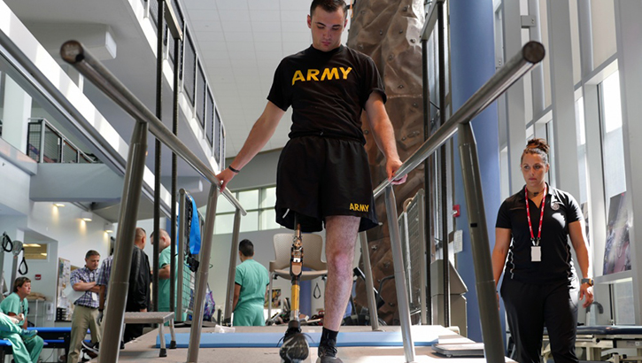 Soldier walking with prosthetic leg