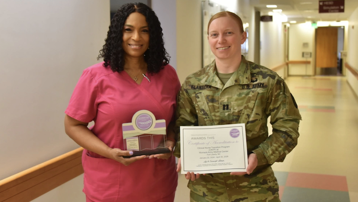 Clinical Nurse Transition Program Director, Kim Howard and Deputy Director, Capt. Holly Flanscha hold plaque and certificate they received from the American Nurses Credentialing Center’s Commission on Accreditation in Practice Transition Programs. Womack Army Medical Center is the second military treatment facility to receive this distinction. (DHA photo by Keisha Frith)