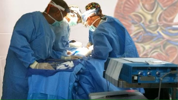 DHA surgeons perform a routine procedure on a patient.