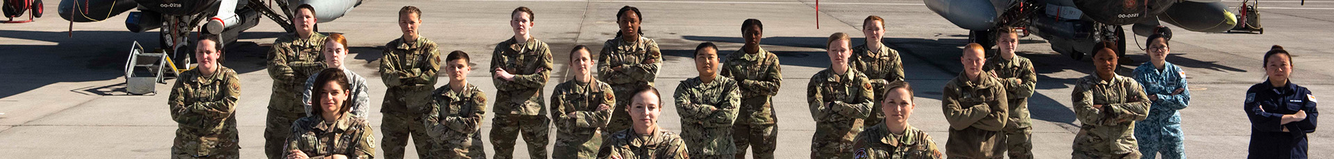 Female service members stand on the flightline for Women's History Month at Nellis Air Force Base, Nevada, March 19, 2021. The service members participated in the Air Force's two-week advanced aerial combat training exercise, Red Flag. (U.S. Air Force photo by Airman 1st Class Natalie Rubenak)